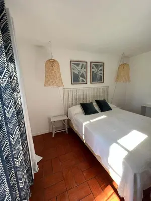 a bedroom with a large white bed with two pillows at T3 Townhouse Old Village Vilamoura in Vilamoura