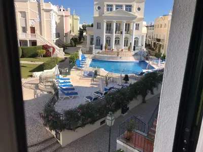 an aerial view of a house with a swimming pool at T2 Apartment Old Village Vilamoura in Vilamoura