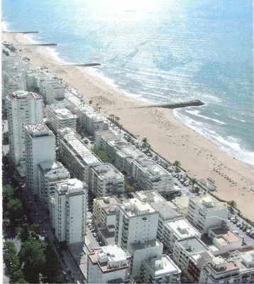 an aerial view of a beach with buildings and condos at Regueiró Quarteira Beach Apartment in Quarteira