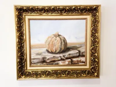 a painting of a pumpkin in a gold frame at Vila Algarvia Boutique & Suites in Albufeira