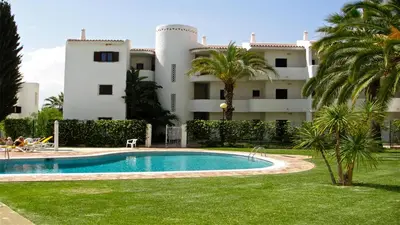 a swimming pool in front of a building at Terraços do Mar 46- Clever Details in Vilamoura