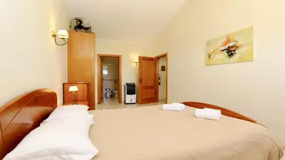 a bedroom with a bed with two white pillows at Falésia Marina - Clever Details in Vilamoura