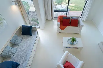 a living room with two chairs and a couch at BmyGuest - Quinta do Lago Mezzanine Apartment in Almancil