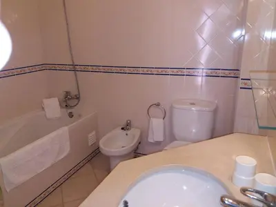 a bathroom with a sink and a toilet at Apartamentos Colina do Mar Downtown Albufeira in Albufeira