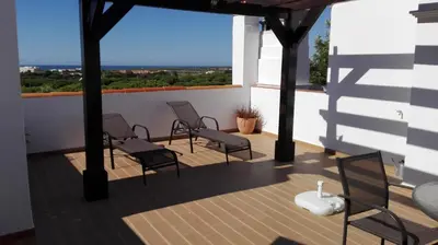 a balcony with chairs and a view of the city at Old Village in Vilamoura