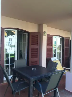 a black table and chairs on a patio at Old Village in Vilamoura