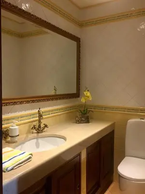 a bathroom with a sink and a mirror at Casa das Figuras in Faro