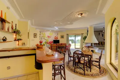 a kitchen and living room with a table and chairs at Villas2go2 V5 Vilamoura XXI in Vilamoura