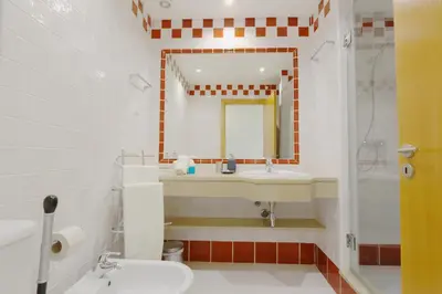 a bathroom with a sink and a mirror at Terraços de Vilamoura 55- Clever Details in Vilamoura