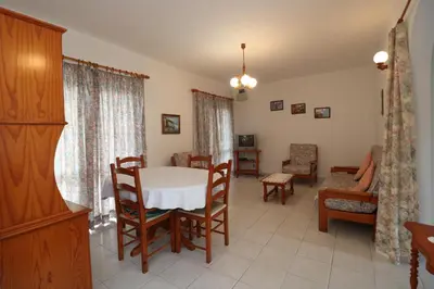 a dining room with a table and chairs at Villa Estela in Albufeira