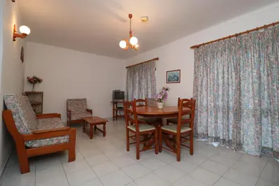 a dining room with a table and chairs at Villa Lena in Albufeira