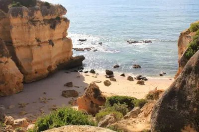 a view of a beach with rocks and the ocean at Villa Lena in Albufeira