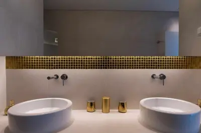 a bathroom with two sinks in front of a mirror at Marina Vilamoura Penthouse Aquamar 606 in Vilamoura