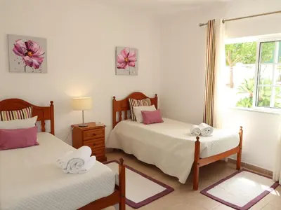 a bedroom with two beds and a window at Holiday Home Monte Novo by Interhome in Paderne