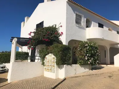 a white building with a gate in front of it at VILAMOURA FÉRIAS by Ethnic Ocean in Vilamoura