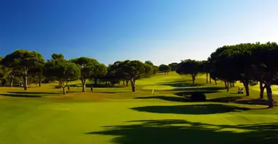 a view of a golf course with trees and a green at Vilamoura Garden House - Golf & Beach in Vilamoura