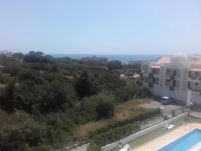 an aerial view of a building and a swimming pool at Albufeira INN - Elimar 3 T1 in Albufeira
