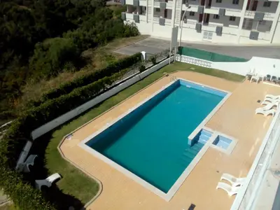 an overhead view of a swimming pool in a building at Albufeira INN - Elimar 5 T1 in Albufeira