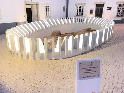 a white fence in front of a building at Casa 