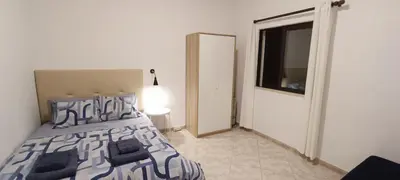 a bedroom with a bed and a window and a door at Casa 