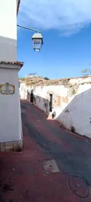 a street with a light on the side of a building at Casa 