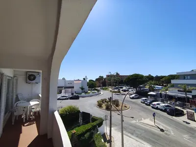 a view of a street from a balcony of a building at Praia dos Aveiros T1 - Albufeira INN in Albufeira