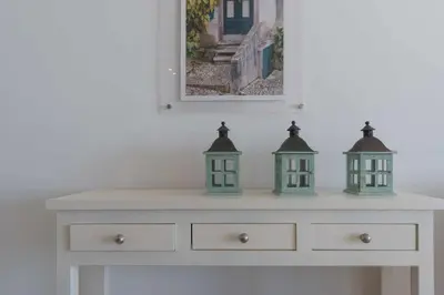 a white dresser with two lights on top of it at Marina Vilamoura Aquamar 504 by VilamouraSun in Vilamoura
