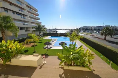 an overhead view of a swimming pool in front of a building at Marina Vilamoura - Aquamar 301 - By Vilamoura Sun in Vilamoura