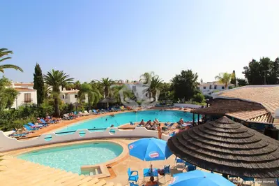 two beds sitting next to each other in a bedroom at Apartamentos São Rafael - Albufeira, Algarve in Albufeira