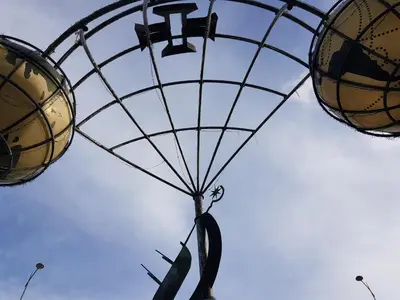 a person is riding a parachute in the sky at Villa Coelho - By Algarkasa in Albufeira