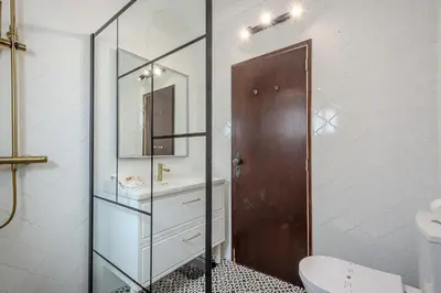 a bathroom with a sink and a toilet and a mirror at Villa Amendoeira-POOL HEATED - By Algarkasa in Guia