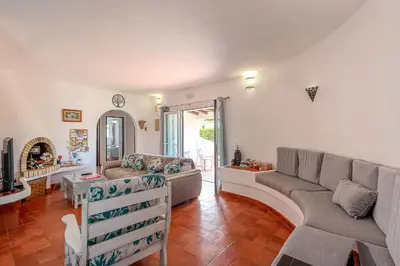 a living room with a couch and a table at Villa Amendoeira-POOL HEATED - By Algarkasa in Guia