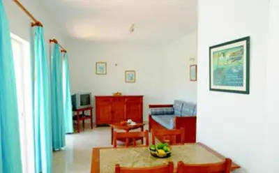 a living room with a couch and a table at Villas King's in Albufeira