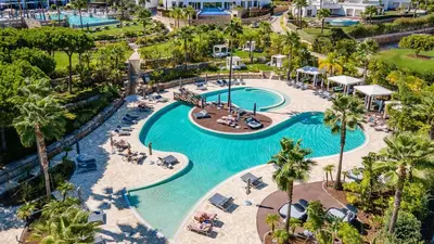 an aerial view of a pool at a resort at Conrad Algarve in Quinta do Lago