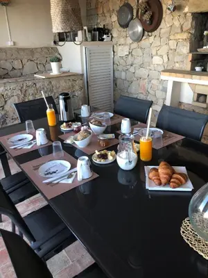 a table with plates of food on it at Felicidade in Loulé
