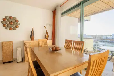 a white bedroom with a large bed and a window at Marina Vilamoura - Aquamar 309 By Vilamoura Sun in Vilamoura