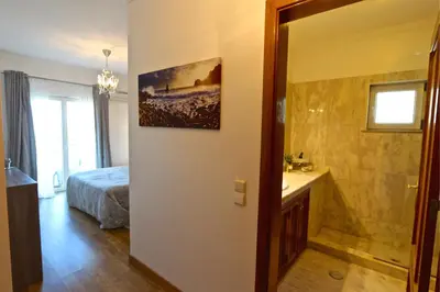 a bathroom with a sink and a bed in a room at Villa Heloise 139 - Clever Details in Vilamoura
