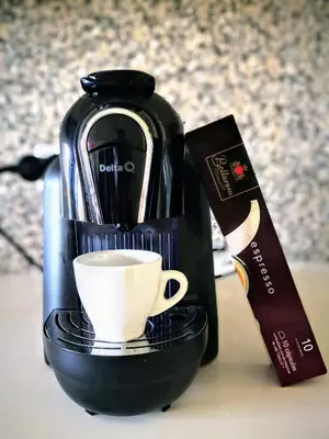 a coffee maker and a cup on a table at Algarve 