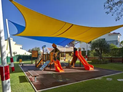 a park with a playground with a slide at Four Seasons Vilamoura in Vilamoura
