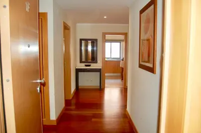 an empty hallway with a hallway leading to a room at Corcovada in Albufeira