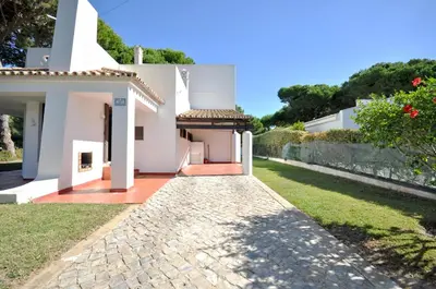 a group of lounge chairs next to a swimming pool at Perfect Retreat Overlooking Pinhal Golf Course, Private pool, Off-street parking in Loulé