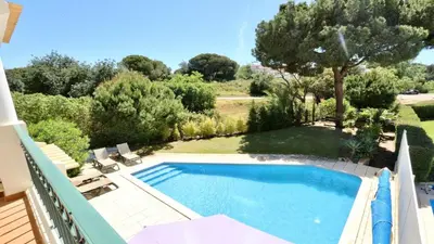 a bedroom with a bed with two towels on it at Villa Amendoeira 4 - Clever Details in Vilamoura