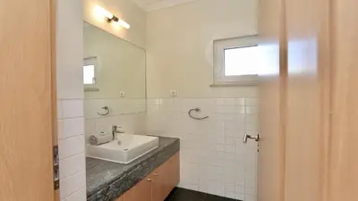 a kitchen with a white refrigerator and a sink at Villa Amendoeira 4 - Clever Details in Vilamoura