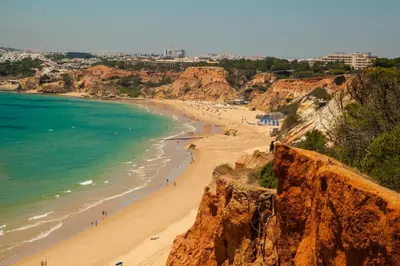 a view of a beach with people on it at Falesia Beach A in Roja- Pé
