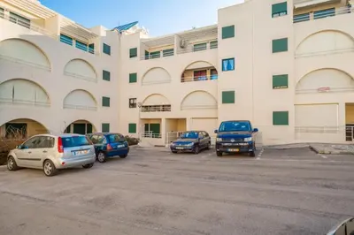 a parking lot in front of a large building at Akisol Albufeira Guia II in Guia