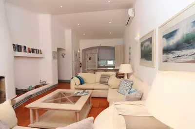 a living room with a couch and a table at Villa Molgard 61 - Clever Details in Vilamoura