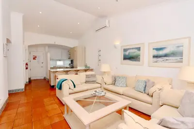 a living room with a couch and a table at Villa Molgard 61 - Clever Details in Vilamoura