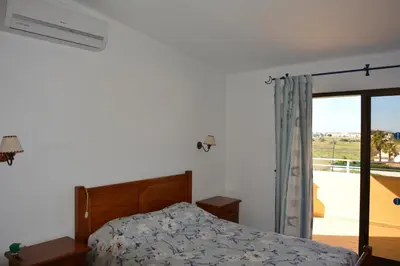 a bedroom with a bed and a window at Villa Paraiso - 4 Bedrooms and pool in Albufeira