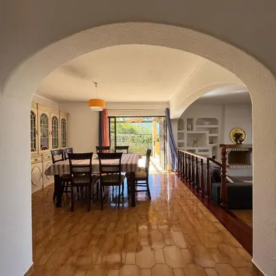 a dining room with a table and chairs at Villa Paraiso - 4 Bedrooms and pool in Albufeira
