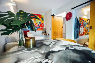 a room with a table with a plant on it at Casa do Sal in Albufeira